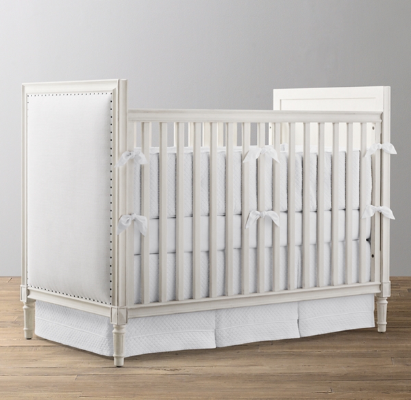 white upholstered crib