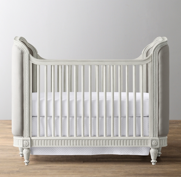 white upholstered crib