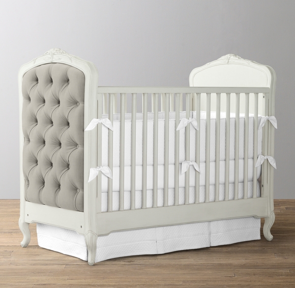 white upholstered crib